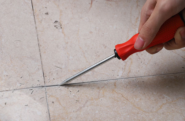 Grout removal tool removal hook application