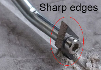 Grout removal tool with sharp edges