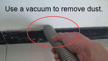 Use a vacuum to remove dust
